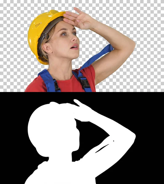 Engineer construction worker woman fascinated by the scale of construction, Alpha Channel — Stock Photo, Image