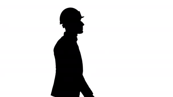 Silhouette Αρχιτέκτονας σε λευκό κράνος περπάτημα. — Αρχείο Βίντεο