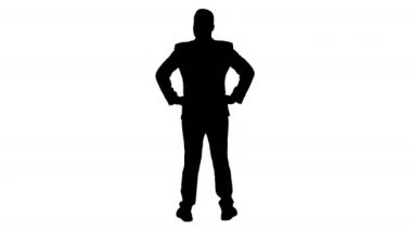 Siluet işadamı elleri kalçasında etrafa bakıyor..