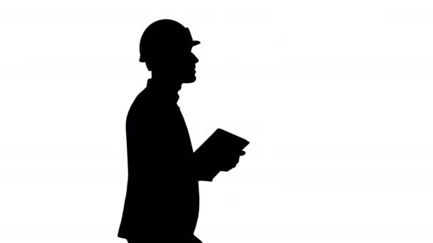 Silhouette Architect walking with tablet and checking what is built. — Stock Video