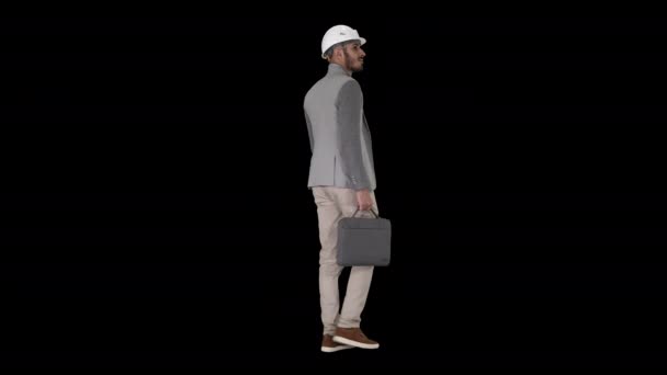 Engineer in helmet with briefcase walking, Alpha Channel — Stock Video