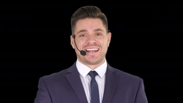 Man in formal clother with a headset presenting something, Alpha Channel — Stock Video