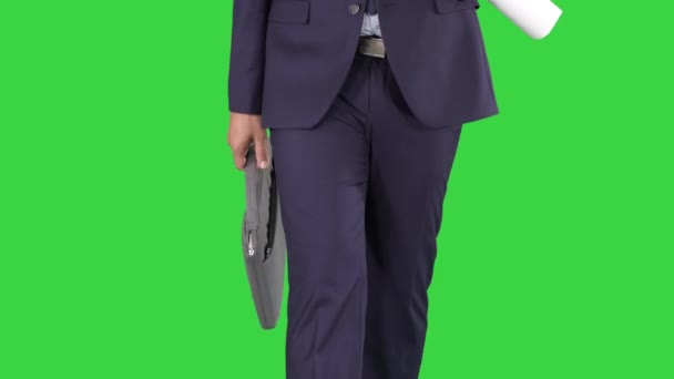 Young construction architect with briefcase walking on a Green Screen, Chroma Key. — Stock Video