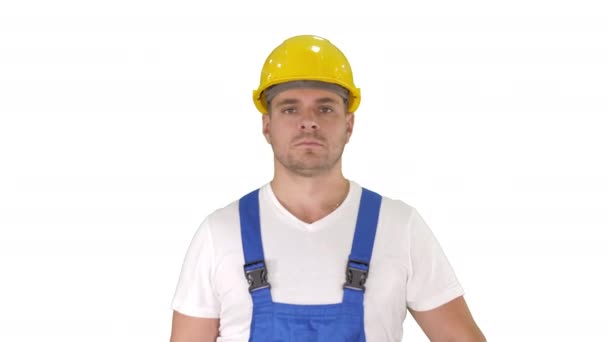 Builder walking and looking to camera on white background. — Stock Video