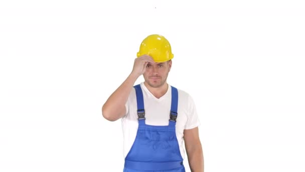 Construction worker walking and putting on hard hat or helmet on white background. — Stock Video