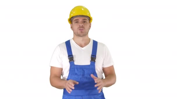 Foreman builder explaining something to camera and talking on white background. — Stock Video