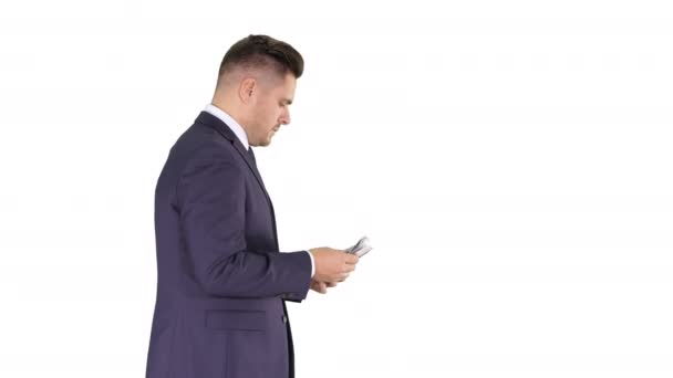 Business man walking counting euro bills on white background. — Stock Video