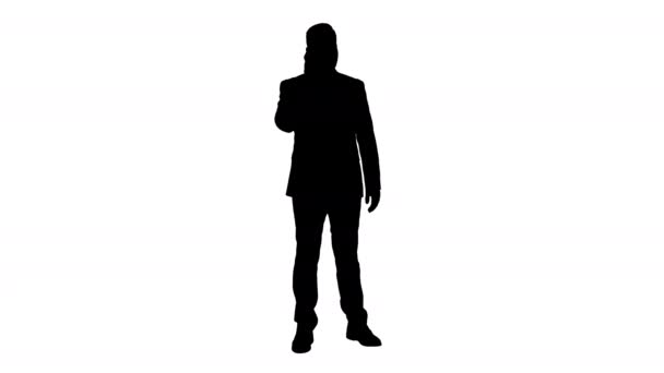 Silhouette gondolkodó fiatal üzletember, öltöny és nyakkendő így több hívás gyorsan. — Stock videók
