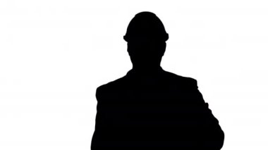 Silhouette mimar ya da mühendis yürüyüş silah projeleri tutarken gülümseyen. İşgücü konsepti.