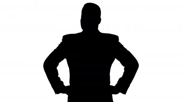 Silhouette Homme d'affaires regardant autour avec les mains sur les hanches. — Video
