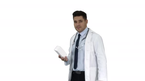 Confident Doctor Smiling and Presenting in Hand New Treatment on white background. — Stock Video