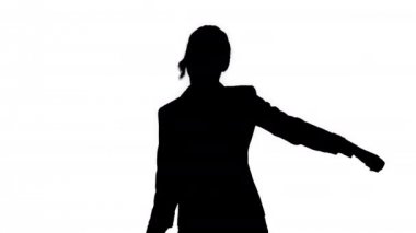 Silhouette sevimli emin genç iş kadın dans.