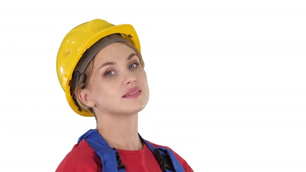 Female construction worker greeting on white background. — Stock Video