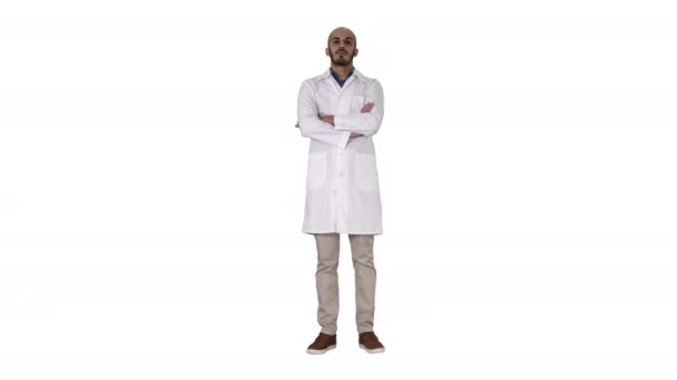 Serious arabian doctor mature male with crossed arms on white background. — Stock Video