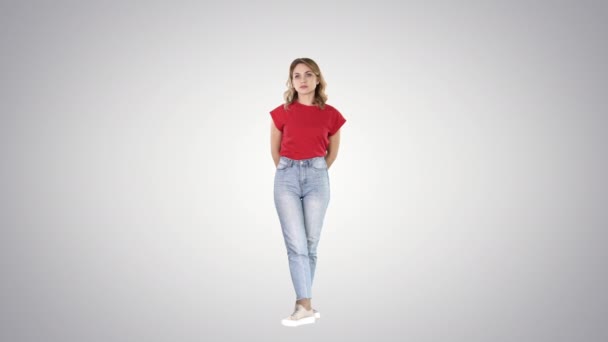 Young girl listening something attentively on gradient background. — Stock Video