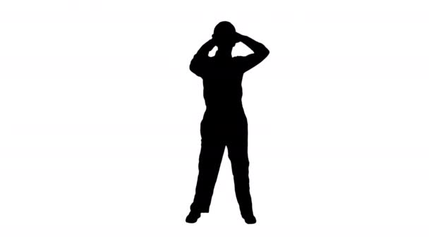 Silhouette Single construction worker puts on safety hat and does some cool dancing. — Stock Video