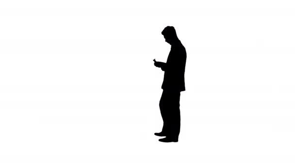 Silhouette Young happy businessman dancing after counting salary. Win dance. — Stock Video