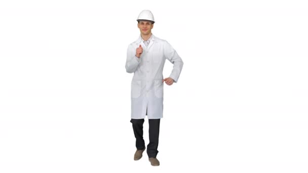 Engineer man dancing in funny way on white background. — Stock Video