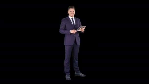 Expressive young businessman with tablet presenting something swiping, Alpha Channel — Stock Video