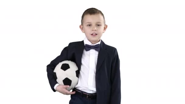 Menino da escola feliz segurando uma bola no fundo branco . — Vídeo de Stock