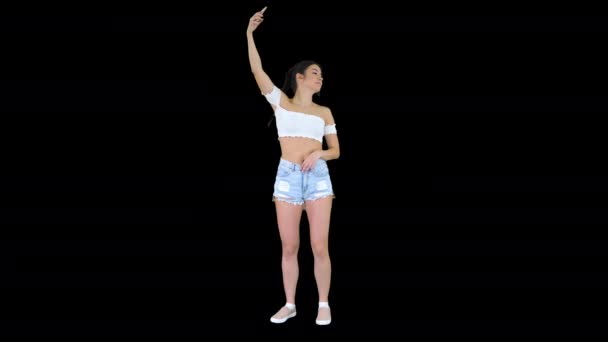 Cute brunette girl takes a selfie and dancing, Alpha Channel — Stock Video