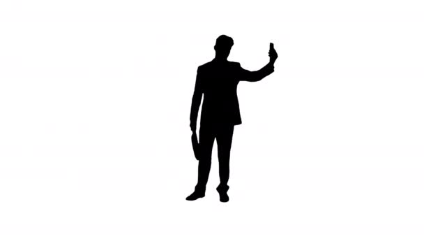 Silhouette Giovane uomo d'affari che prende selfie con il suo telefono . — Video Stock