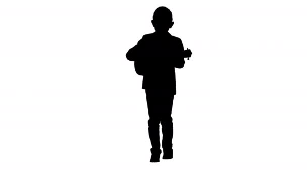 Silhouette Boy en un disfraz caminando y jugando ukelele . — Vídeo de stock