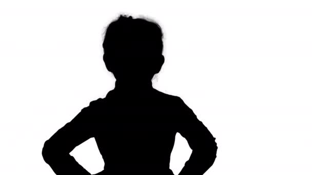 Silhouette Cute little girl in white dress posing on camera. — Stock Video