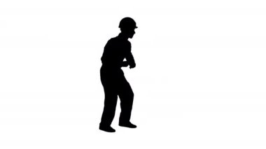 Silhouette Sert şapka dans hip-hop genç inşaat işçisi.