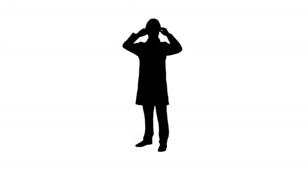 Silhouette Jeune ingénieur dansant avec casque après le travail . — Video