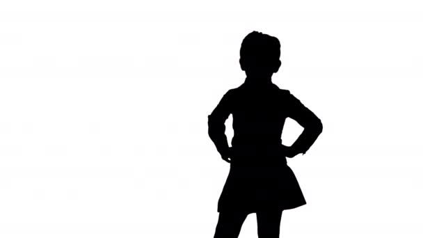 Silhouette Little smiling girl in white poses. — Stock Video