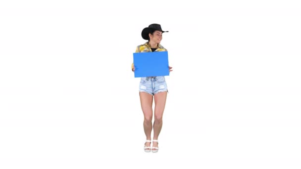 Smiling pretty cowgirl holding empty board and dancing on white background. — Stock Video