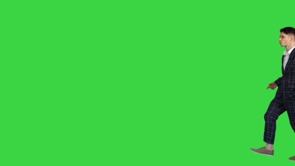 Man in formal business suit walks in and dances several hip hop moves to camera on a Green Screen, Chroma Key. — Stock Video