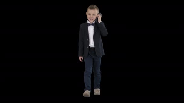 Little boy in a costume making a phone call while walking, Alpha Channel — Stock Video