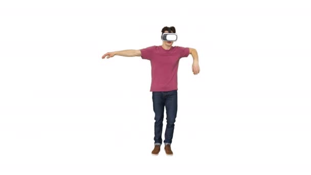 Casual gamer dancing locking hip-hop in VR headset playing dancing game on white background. — Stock Video