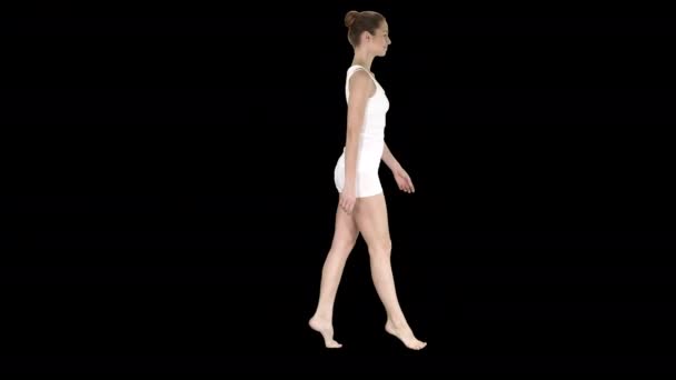 The young woman walking on her tip-toes, Alpha Channel — Stock Video