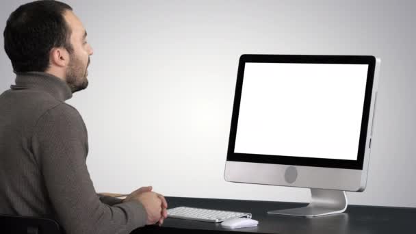 Young Businessman Making Video Call On His Computer on gradient background. — Stock Video