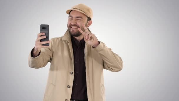 Young adult man handsome taking selfie on gradient background. — Stock Video