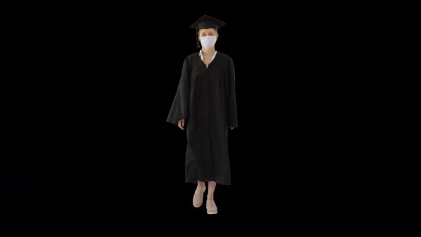 Absolwentka Cap and Gown Wearing Medical Mask Walking, Alpha Channel — Wideo stockowe