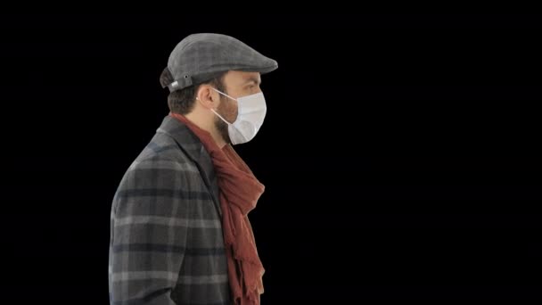 Gentleman wearing a protective face mask walking, Alpha Channel — Stock Video