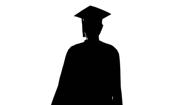 Silueta Graduada en Gorra y Vestido con Máscara Médica Caminando . —  Fotos de Stock