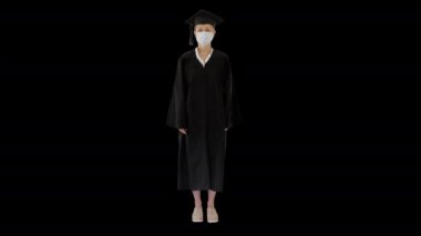 Tıp maskeli bir kadın öğrenci, Alpha Channel 'da ayakta duruyor.