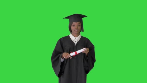 African American female graduate holding diploma and giving speech on a Green Screen, Chroma Key. — Stock Video