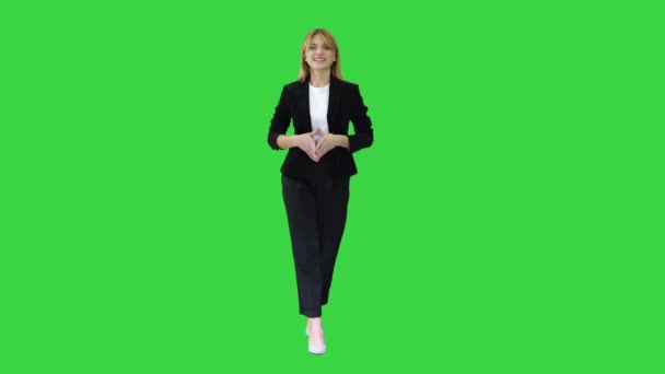 Young Successful Businesswoman Walking and Smiling on a Green Screen, Chroma Key. — Stock Video