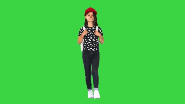 Asian girl walking to school on a Green Screen, Chroma Key. — Stock Video