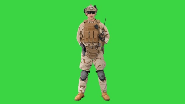 US Military Soldier in Uniform Reports on a Green Screen, Chroma Key. — Stock video