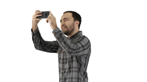 Anak muda mengambil selfie pada latar belakang putih. — Stok Foto