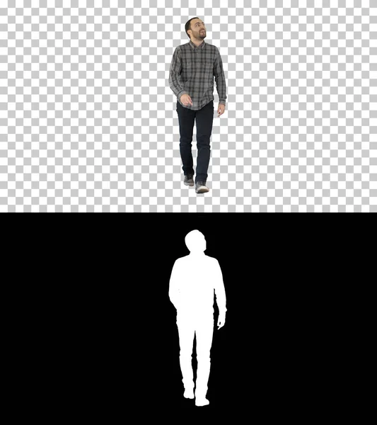 Giovane uomo che cammina guardando in alto affascinato, Alpha Channel — Foto Stock