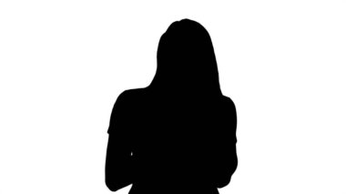 Siluet Sarışın kız cep telefonu tutuyor genç kadın, cep telefonu bağımlılığı, online randevu uygulaması, iletişim, yeni teknolojiler, moda kavramları.