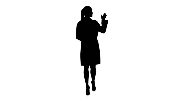 Silhouette Dottoressa che mostra qualcosa con le mani tese. Presentazione. — Foto Stock